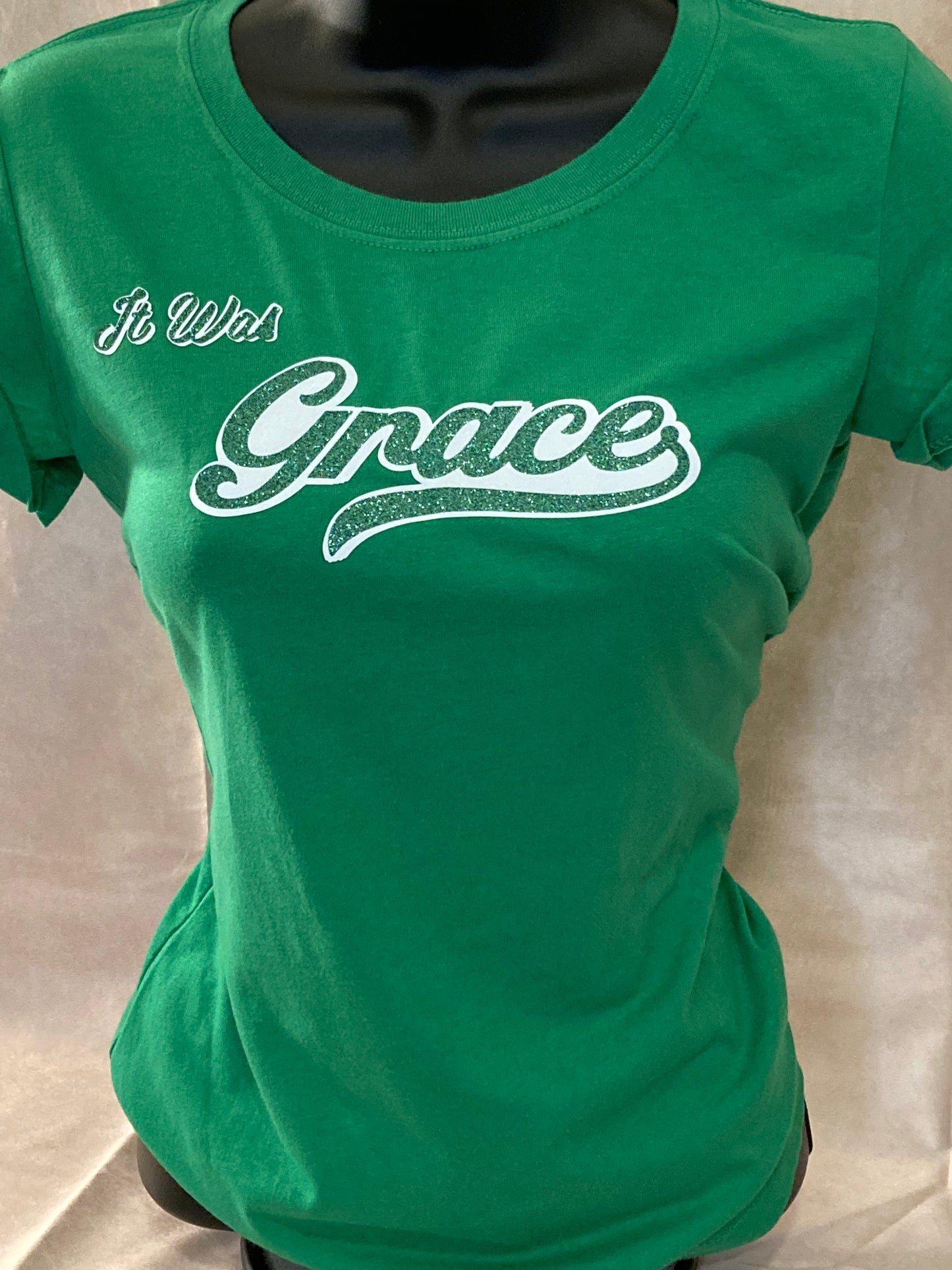 `Women’s Green “It Was Grace” Tee, Short Sleeve, Slight form fit, Soft feel, Machine Washable. 60% Cotton, 40% Polyester