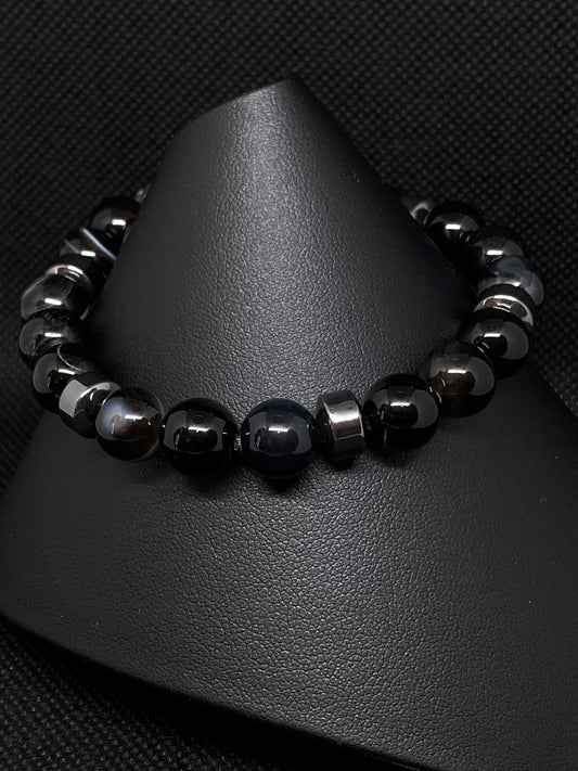 10mm Natural, Genuine Black Agate Stones with Accented Hemalyke. Black Agate gemstones have natural banding occurrence of warm and clear tones throughout the surface of the stones. 