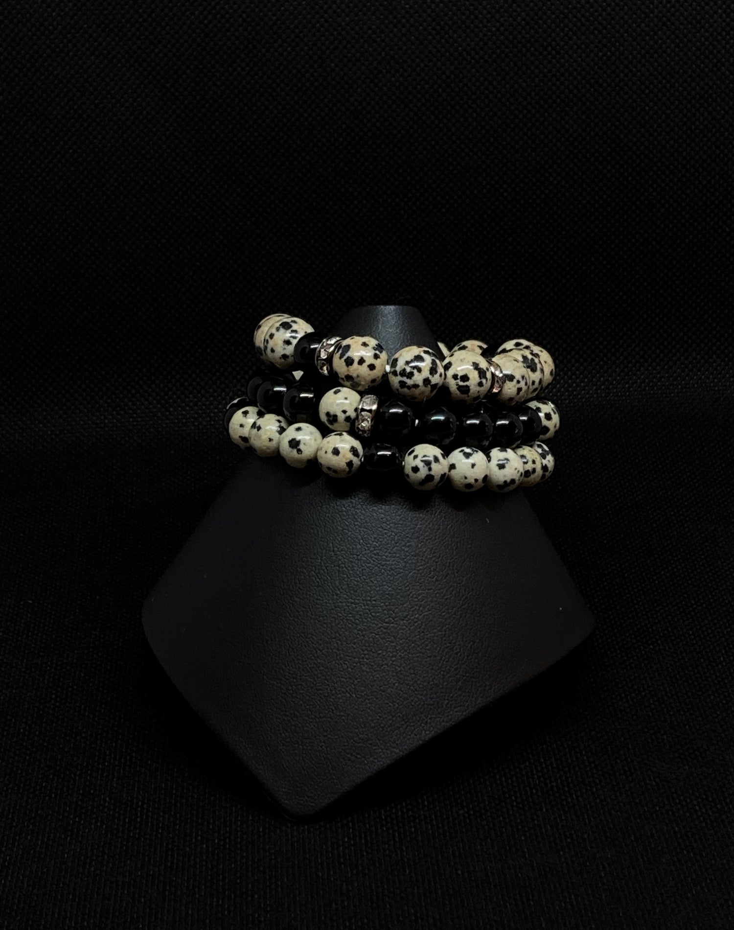 Natural Dalmation Jasper Gemstones. 3-stack bracelet. Dalmation Jasper is opaque light brown with black spots; Black Obsidian gemtstones and accented with Rondelle Crystal Spacers. 