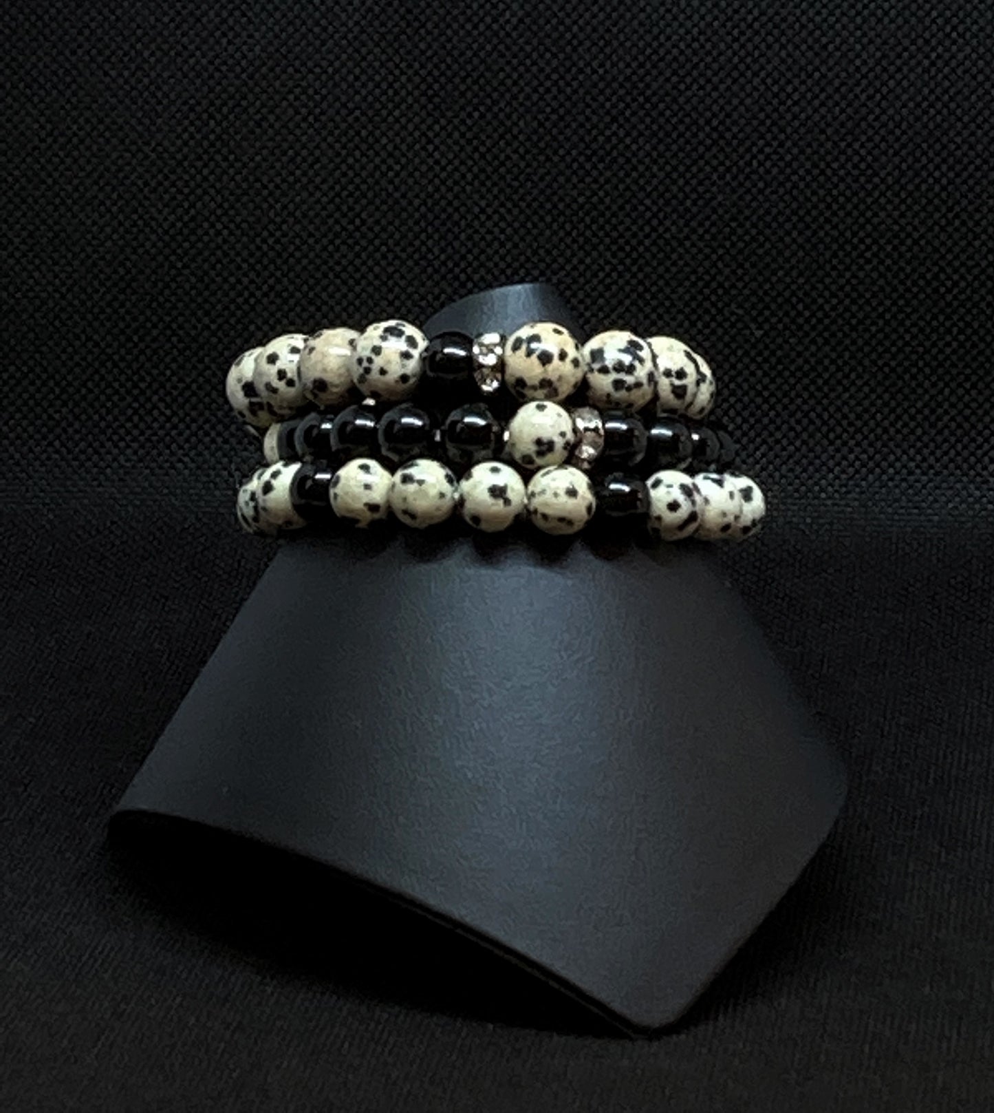 Natural Dalmation Jasper Gemstones. 3-stack bracelet. Dalmation Jasper is opaque light brown with black spots; Black Obsidian gemtstones and accented with Rondelle Crystal Spacers. 