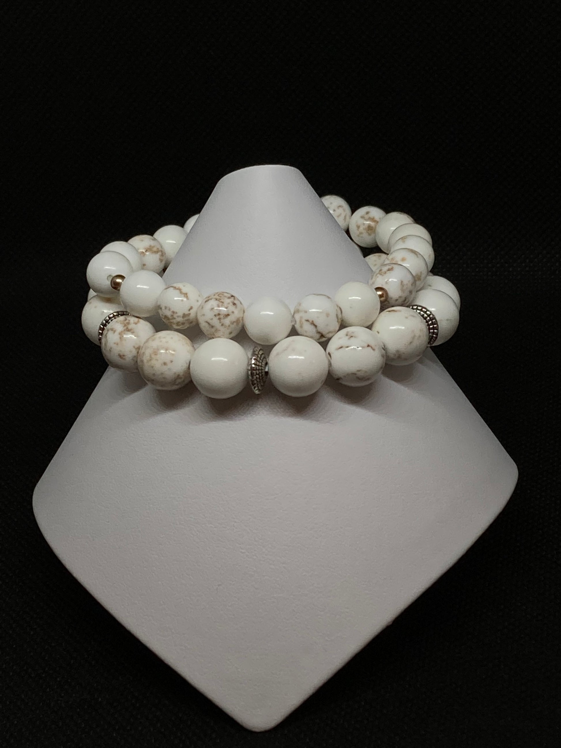10mm/8mm Natural Magnesite Stones accented with 3mm crystal vintage gold pearls and antique silver spacers. 