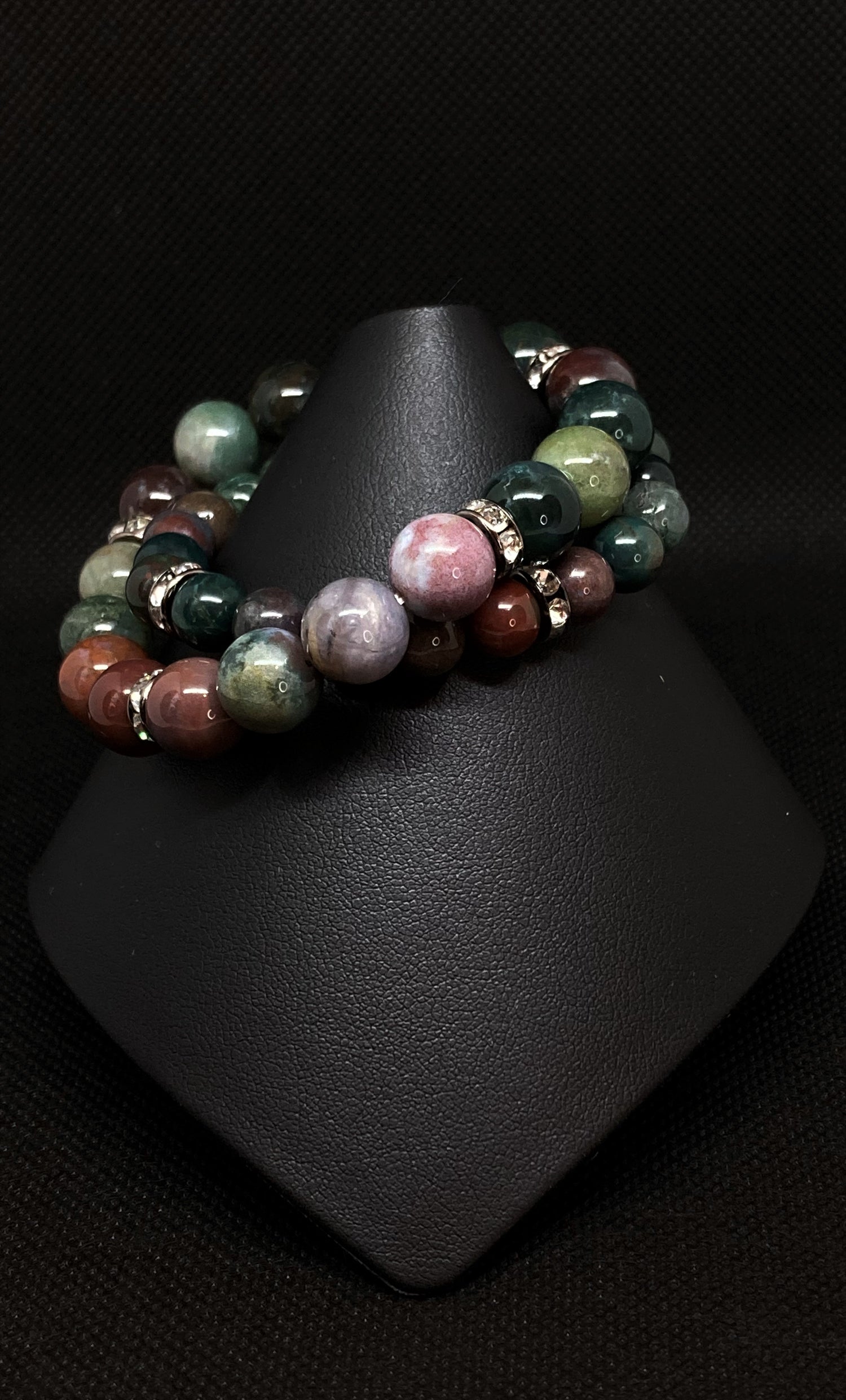 10mm/8mm  2-stack bracelet. Fancy Jasper stones have blended tones of mauve, cream, green and lilac generating a dazzling mixture of rich color. Accented with crystal Rondelle spacers.