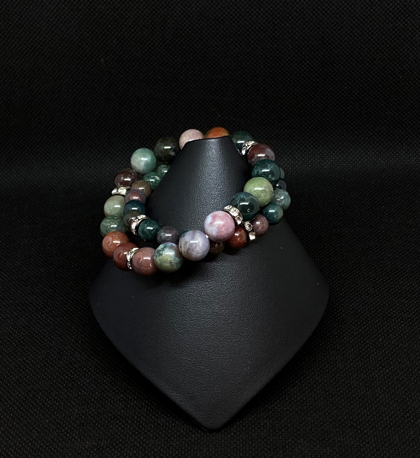 10mm/8mm  2-stack bracelet. Fancy Jasper stones have blended tones of mauve, cream, green and lilac generating a dazzling mixture of rich color. Accented with crystal Rondelle spacers.